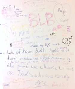 Express Yo'self Wall at Brandeis: jumble of illegible words, and: We all have both light and dark inside us. What matters is the part we choose to act on. that's who we really are.