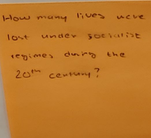 How many lives were lost under socialite regimes during the 20th century?