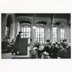 Fr. Monan speaking in Bapst Library.