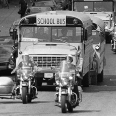 Photo of school buses bringing desegregated children to school