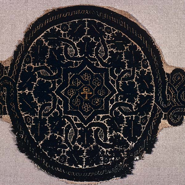 Textile roundel with interlace