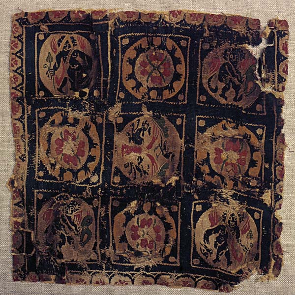 Textile fragment with roundels, tree of life, flowers, Eros figures