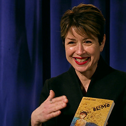 Mary Sherman holds up her book during her interview