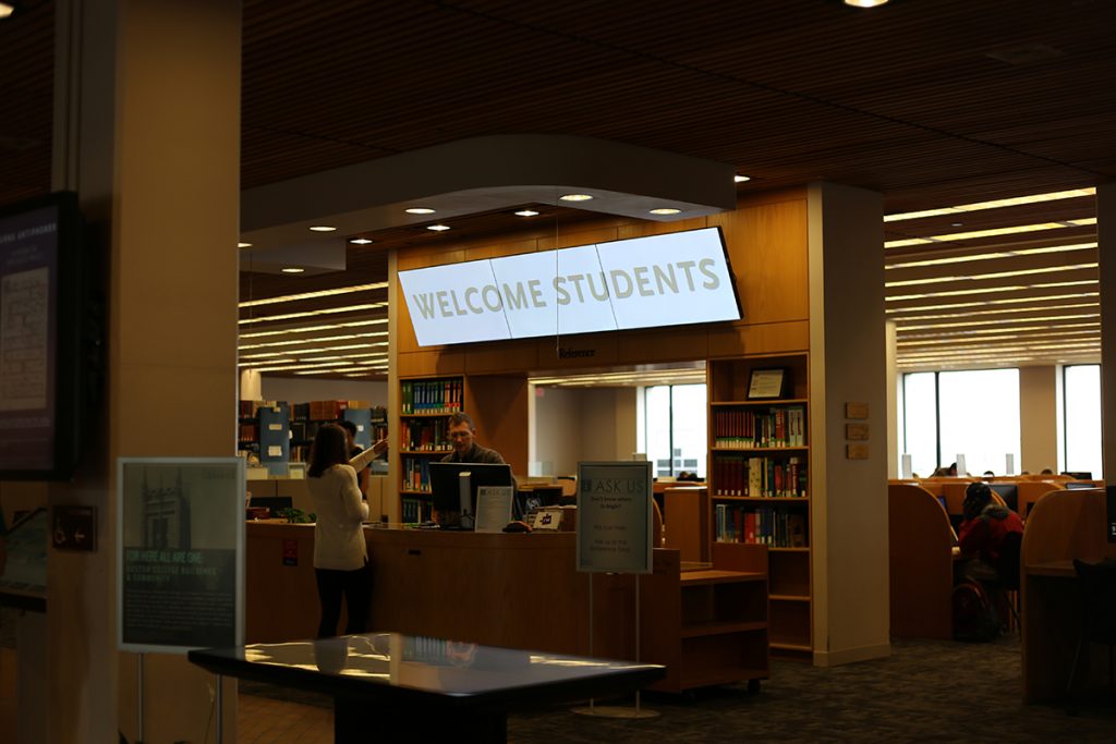 O'Neill Library Level 3 Lobby with video wall display about reference desk