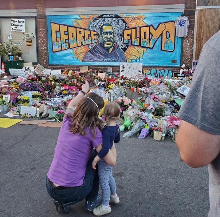 Mother showing her young daughter the mural and shrine for George Floyd in Minneapolis, June 2020. Photo credit: Kate Kipling