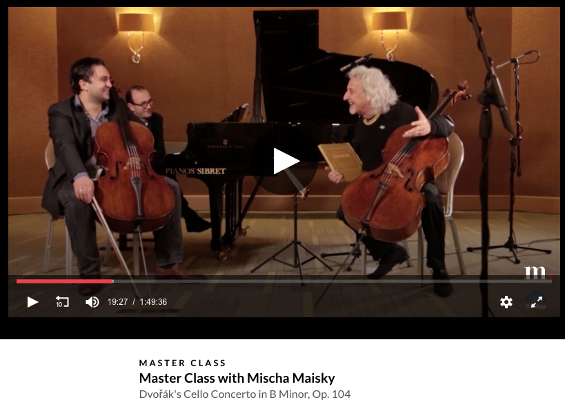 Still image from medici.tv master class with Mischa Maisky, showing the cellist laughing with two students, a cellist and pianist.