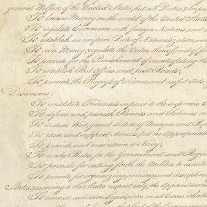 Cropped image of part of the original US Constitution in elegant cursive on parchment