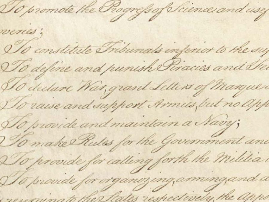 Cropped image of part of the original US Constitution in elegant cursive on parchment