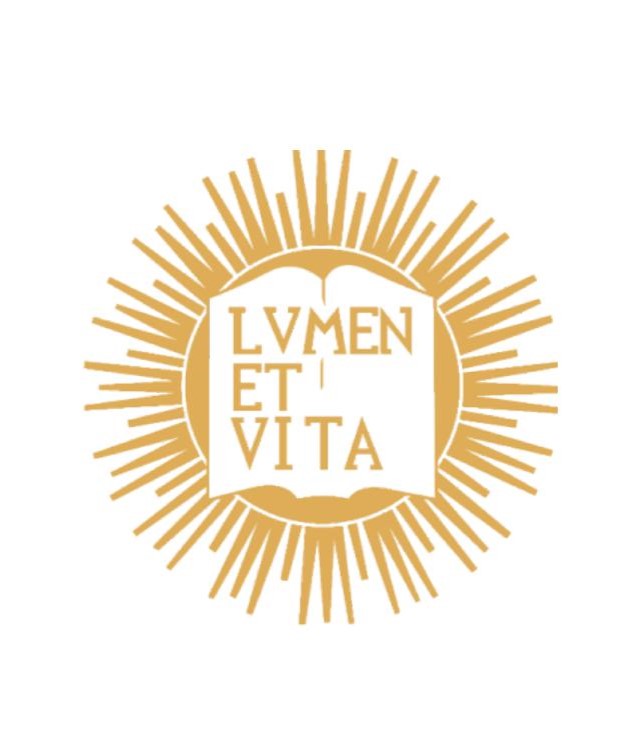 A gold colored logo of the words "LUMEN ET VITA" on a stylized book with a sunburst behind it.