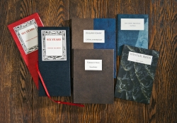 Photo of several poem books resting on a table