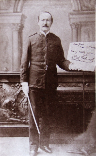 Photo of P.S. Gilmore standing near sheet music